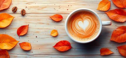 Cozy autumn coffee with heart latte art on wood. A warm cup of coffee with heart-shaped latte art surrounded by colorful autumn leaves on a rustic wooden table. photo