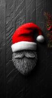 Santa face with festive hat art. A festive creation featuring a Santa Claus face made of fur with a classic red and white hat, set against a dark wooden background. photo