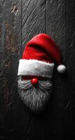Santa hat and beard holiday decor. A festive arrangement featuring a red Santa hat paired with a fluffy gray beard, perfect for Christmas celebration themes. photo