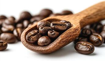 A spoonful of coffee beans is spread out on a white background. Concept of warmth and comfort, as coffee is often associated with relaxation and socializing photo