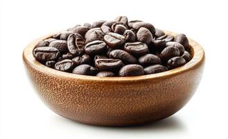 A bowl of coffee beans is shown on a white background. The beans are spread out and appear to be freshly ground. The bowl is wooden and has a rustic feel to it. Concept of warmth and comfort photo