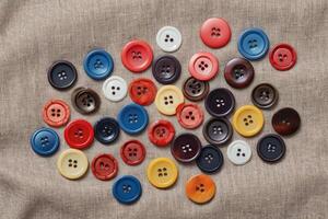 flat lay colorful buttons on cloth photo