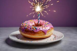 front view birthday donut with lit sparkler photo