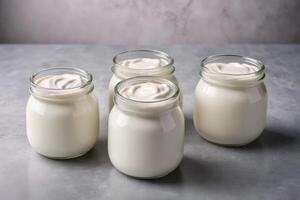 front view plain yogurt in jars photo