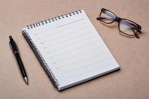high angle list notepad with glasses pen photo