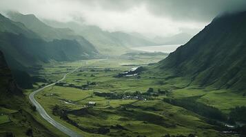 A road winding through a valley with a mountain in the background photo