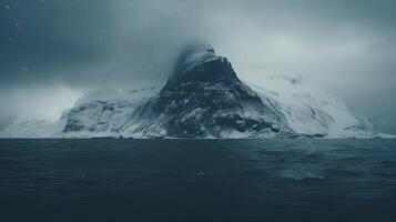 An iceberg in the ocean with snow on it photo