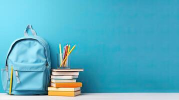 A backpack and books on a table photo