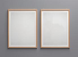 Two empty frames on a wall with a gray background photo
