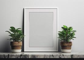 A blank frame with two potted plants on a table photo