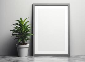 A blank frame with a plant on a table photo