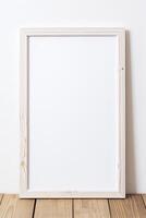 Blank white wooden frame on wooden table photo