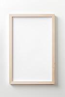 A blank wooden frame on a white wall photo