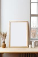 Mockup of a blank frame on a desk in front of a window photo