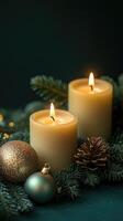 Burning green candles creating festive christmas atmosphere with pine branches and pine cones photo