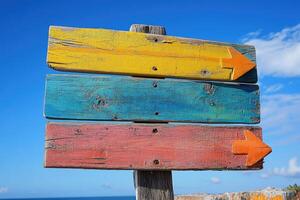 Empty wooden signpost with colorful arrows pointing in different directions photo