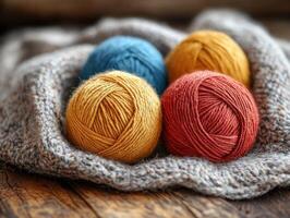 Colorful yarn balls resting on cozy knitted blanket photo