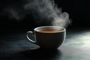 Steam Rising from a Cup of Tea on a Striking Black Background for a Cozy Vibe photo