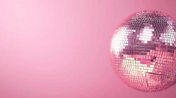 Shiny Disco Ball on Pink Background for Party and Celebration Themes photo