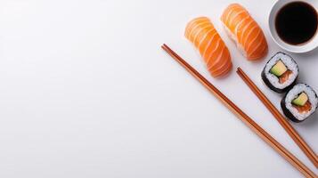 Delicious Sushi Lunch with Salmon Nigiri and Maki Rolls on White Background with Chopsticks and Soy Sauce photo
