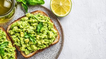 Healthy Avocado Toast with Fresh Basil and Lemon on Whole Grain Bread - Perfect Lunch Break Meal photo