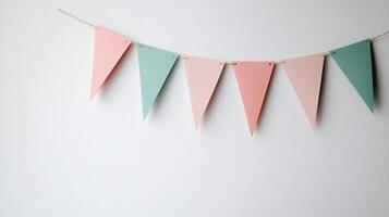 Colorful Party Bunting Flags Hanging on a String Against a White Background for Celebrations and Events photo