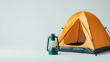 Bright Orange Camping Tent with Lantern - Essential Adventure Equipment for Camping and Climbing Enthusiasts photo