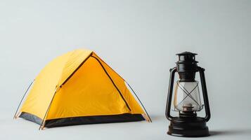 Bright Yellow Camping Tent and Vintage Lantern - Essential Adventure Equipment for Camping and Climbing Enthusiasts photo