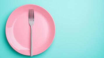 Elegant Dinner Concept with Pink Plate and Silver Fork on a Light Blue Background photo