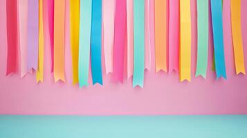 Colorful Party Streamers on Pink Background for Festive Celebrations and Events photo