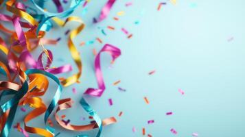 Colorful Party Streamers and Confetti on a Light Blue Background Celebrating Festive Occasions and Joyful Moments photo