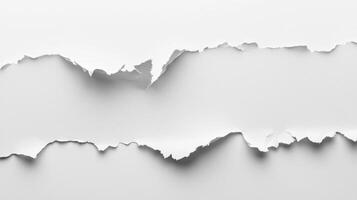 stark white paper features a clean horizontal tear creating a perfect space for text or design elements. The minimalist shadows add depth to the simple beauty. photo