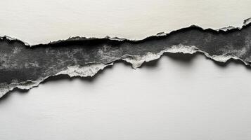 rip in a sheet of paper exposes a contrasting dark surface underneath featuring intricate highly detailed torn edges that create an artistic backdrop. photo