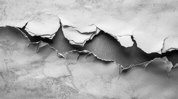 detailed rip in aged paper exposes a deep contrasting surface beneath featuring rough edges that add character and texture perfect for artistic projects. photo