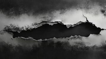 meticulously torn sheet exposes a stark dark backdrop underneath highlighting intricate edges that evoke artistic inspiration and creativity. photo