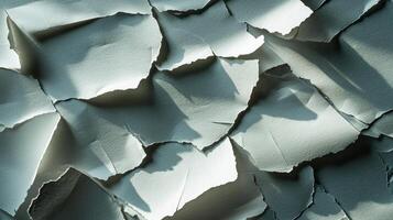 delicate stack torn papers with uneven edges creates an intriguing texture casting soft shadows that enhance the artistic aesthetic ideal for presentations or creative projects. photo