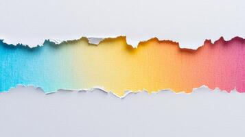 clean top down view showcases white torn paper with a colorful gradient beneath perfect for design projects needing texture and vibrancy. photo