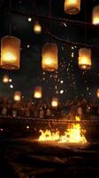 Glowing lanterns hang above as fire dances in the boxing ring creating an intense atmosphere for the thrilling night of fight action ahead. photo