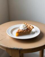 A slice of pie on a white plate on a wooden table photo