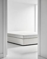 A white room with a bed and a mattress photo