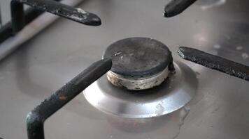 Close up view of a stove being turned on, with the burner igniting and emitting a soft glow video