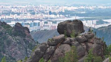 A Majestic Panoramic View of a Bustling Cityscape from the Summit of a Towering Mountain video