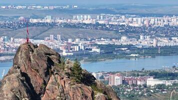Overlooking the City Lights. A Majestic View of a Person Standing on Top of a Mountain video