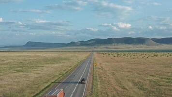 A Lone Truck Making its Way Across an Endless Expanse of Fields video
