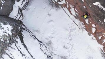 The Adventurous Ascent. A Man Conquering the Snowy Mountain Peaks video