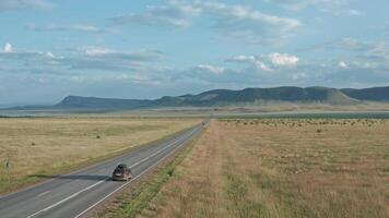 The Solitary Path Through Vast Empty Lands. An Aerial Perspective of a Remote Road video