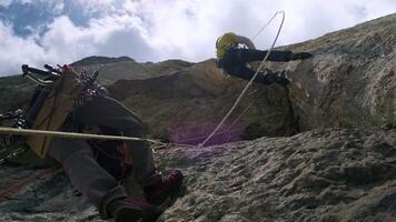 Conquering the Heights. A Fearless Adventurer Climbing a Mountain with Determination and Courage video