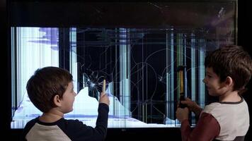 Boys Entertaining using hammers looking at a broken TV screen video