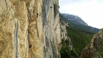 Scaling New Heights. A Fearless Adventurer Tackling the Treacherous Cliff Face video
