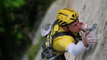 Ascending the Majestic Peak. A Fearless Adventurer Conquering the Daunting Mountain Face video